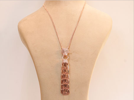 Rose gold panther face sleek tassel pendant
