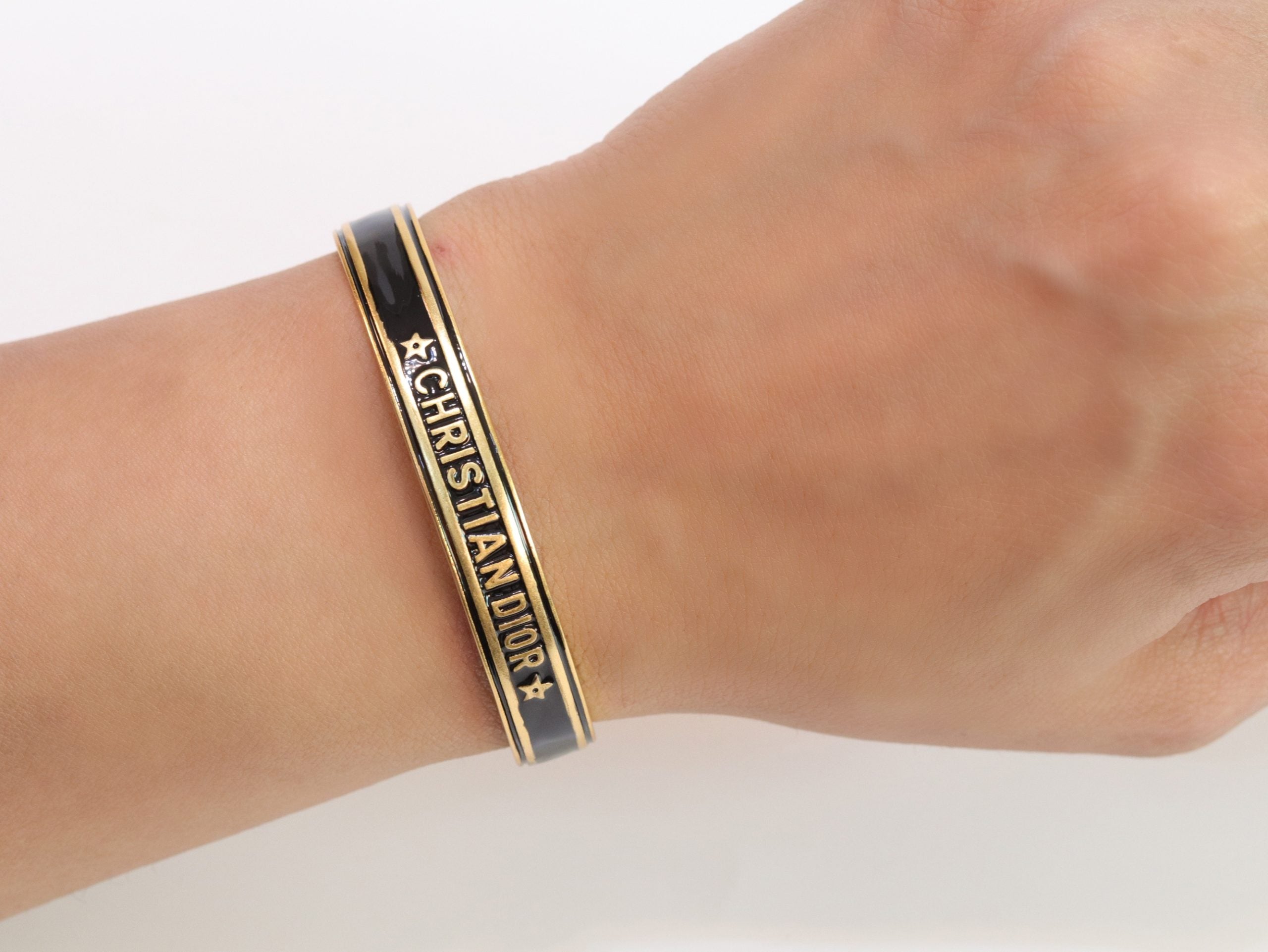 Alphabet C & D black open bracelet in gold finish
