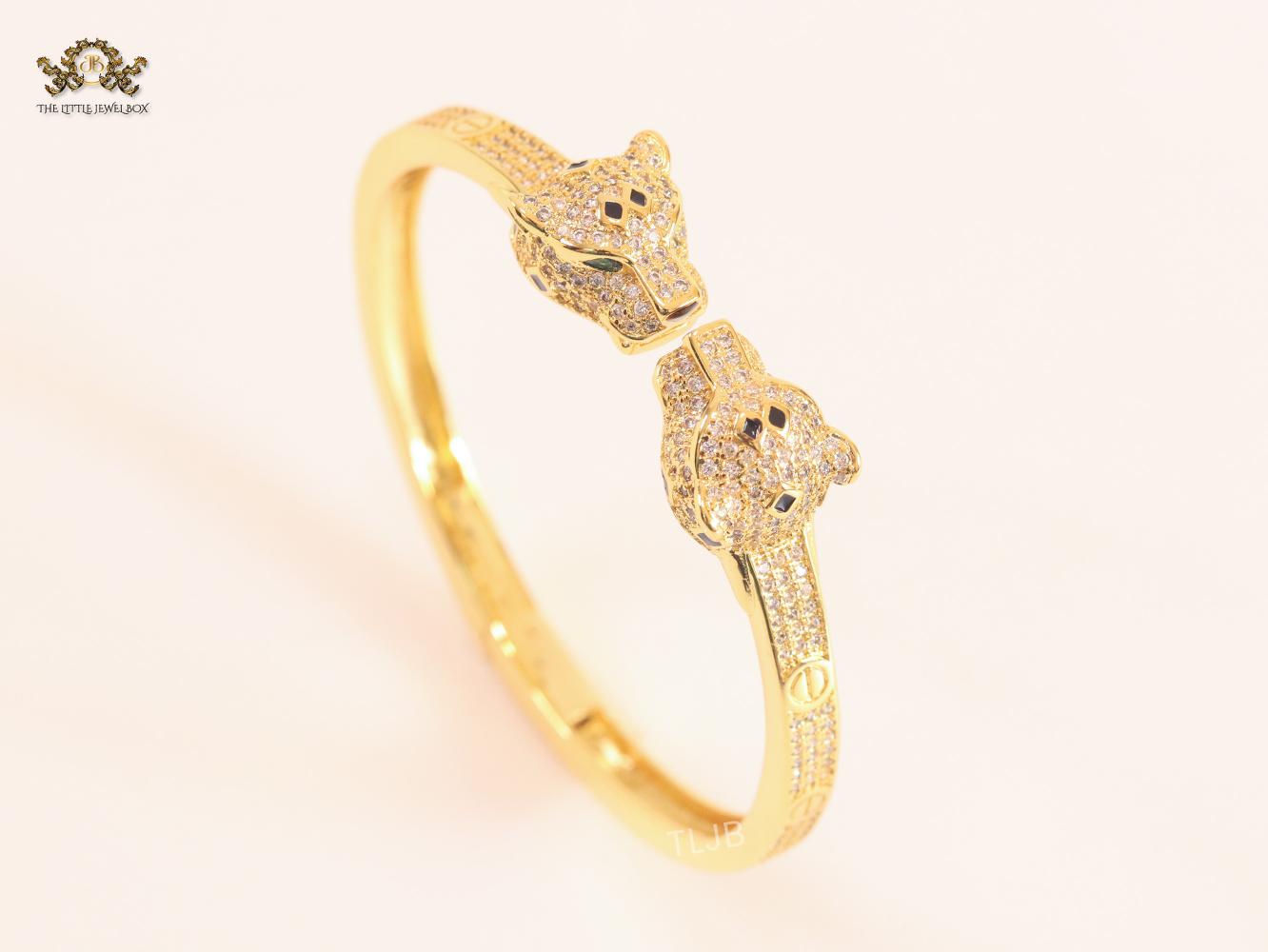 Panther heads gold and emerald bracelet