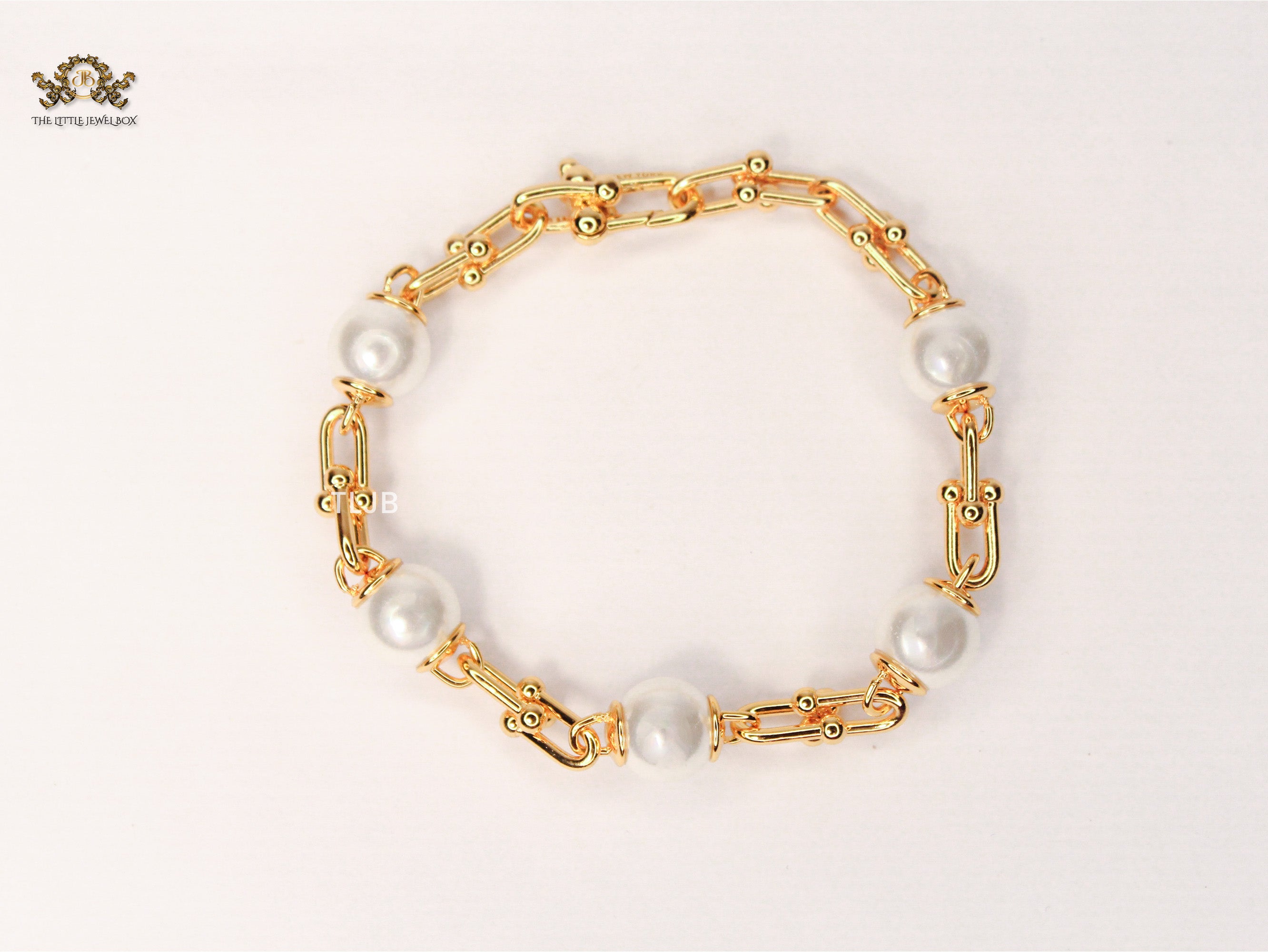 Gold and pearl Tiff & Co linked chain bracelet
