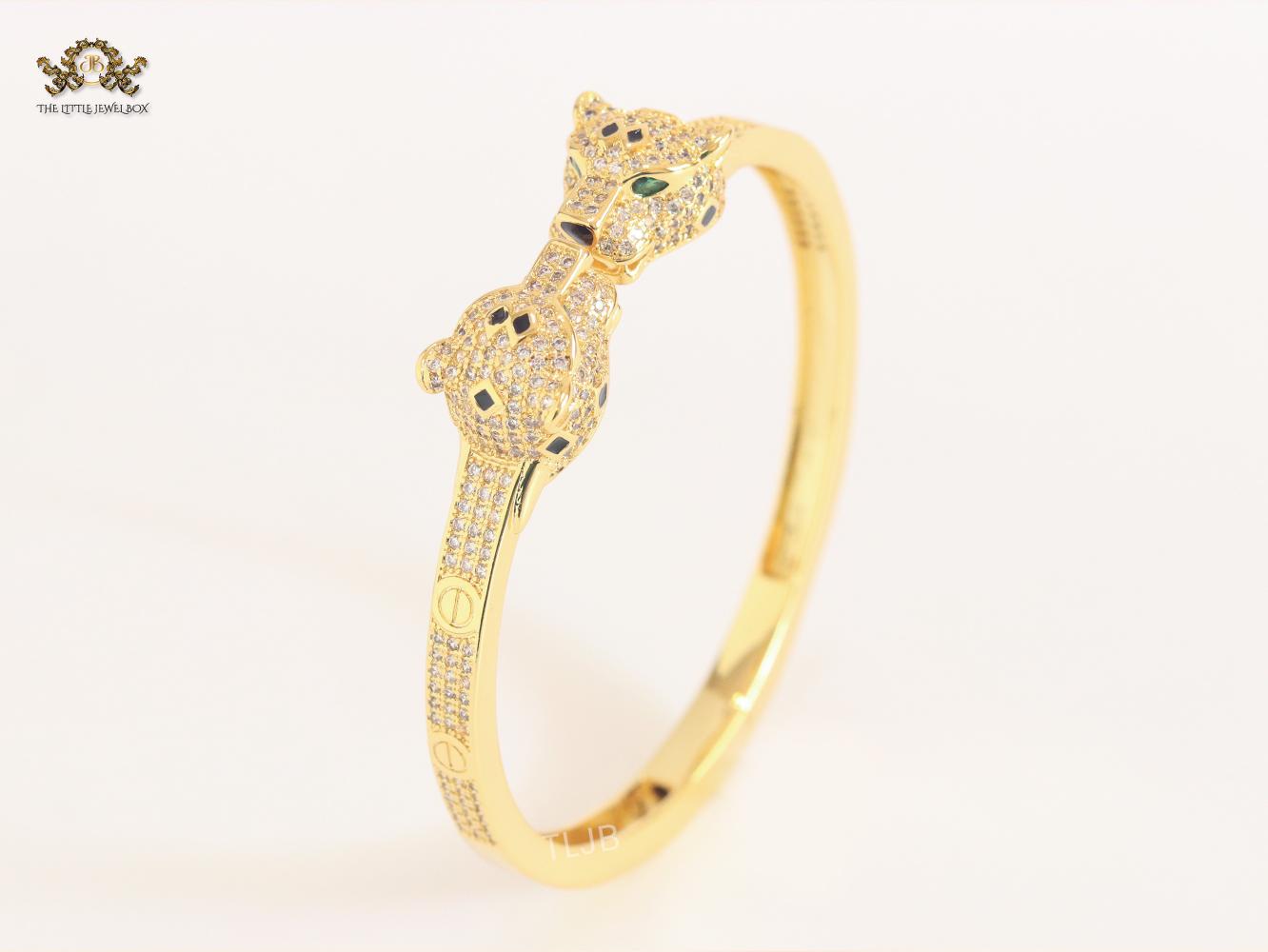 Panther heads gold and emerald bracelet