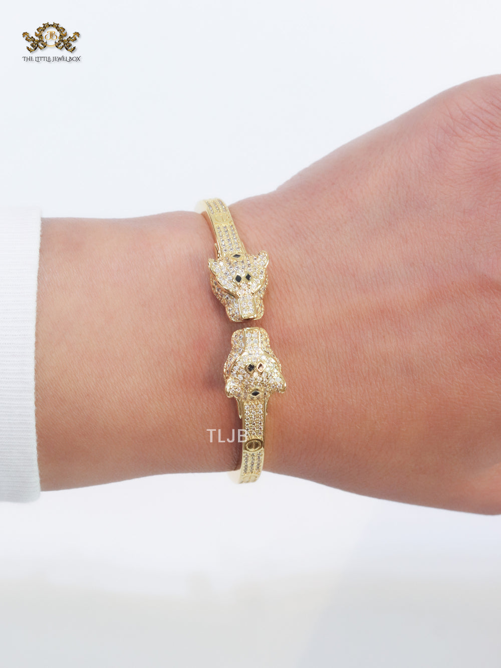 Panther heads gold and emerald bracelet