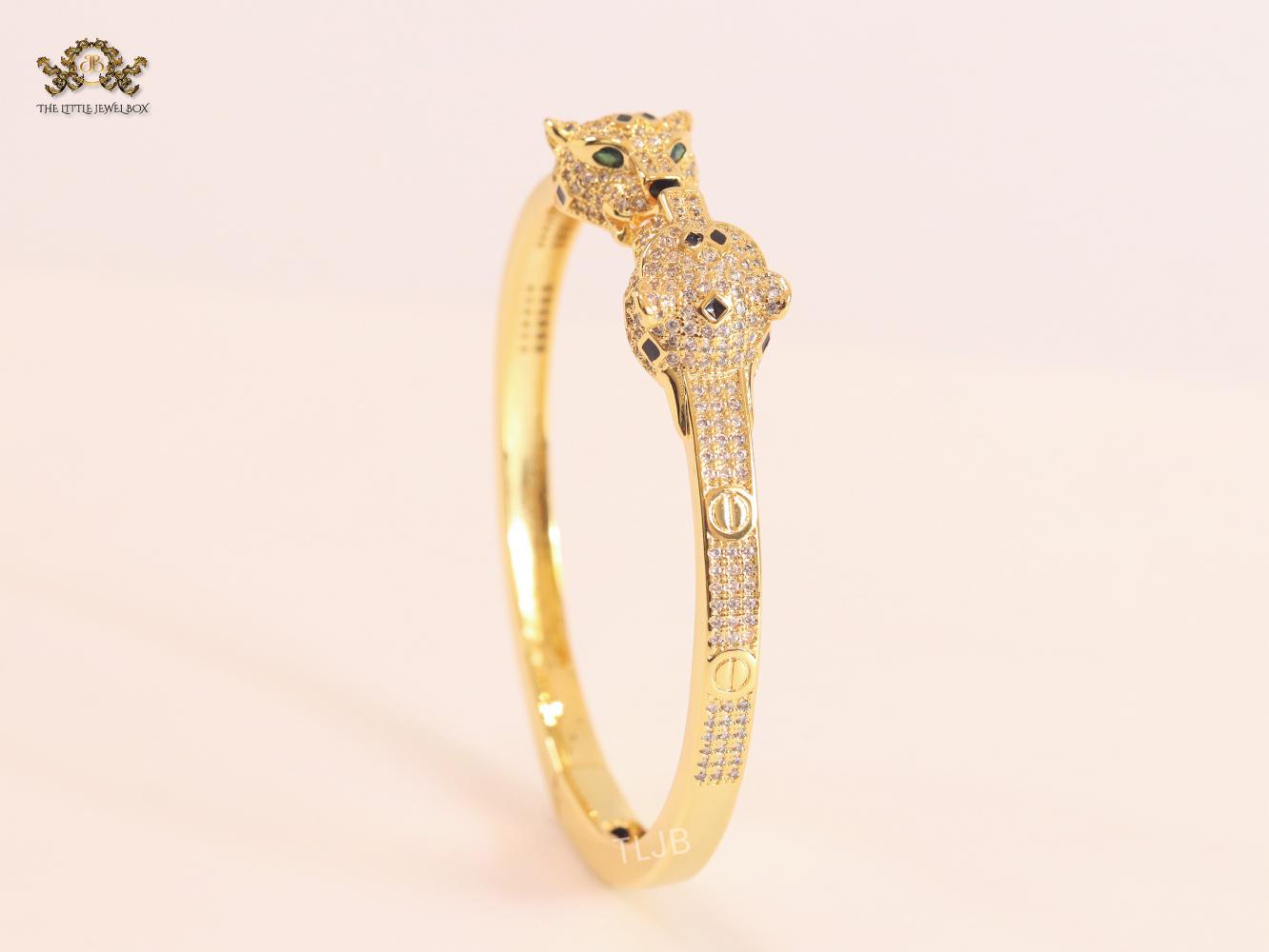 Panther heads gold and emerald bracelet