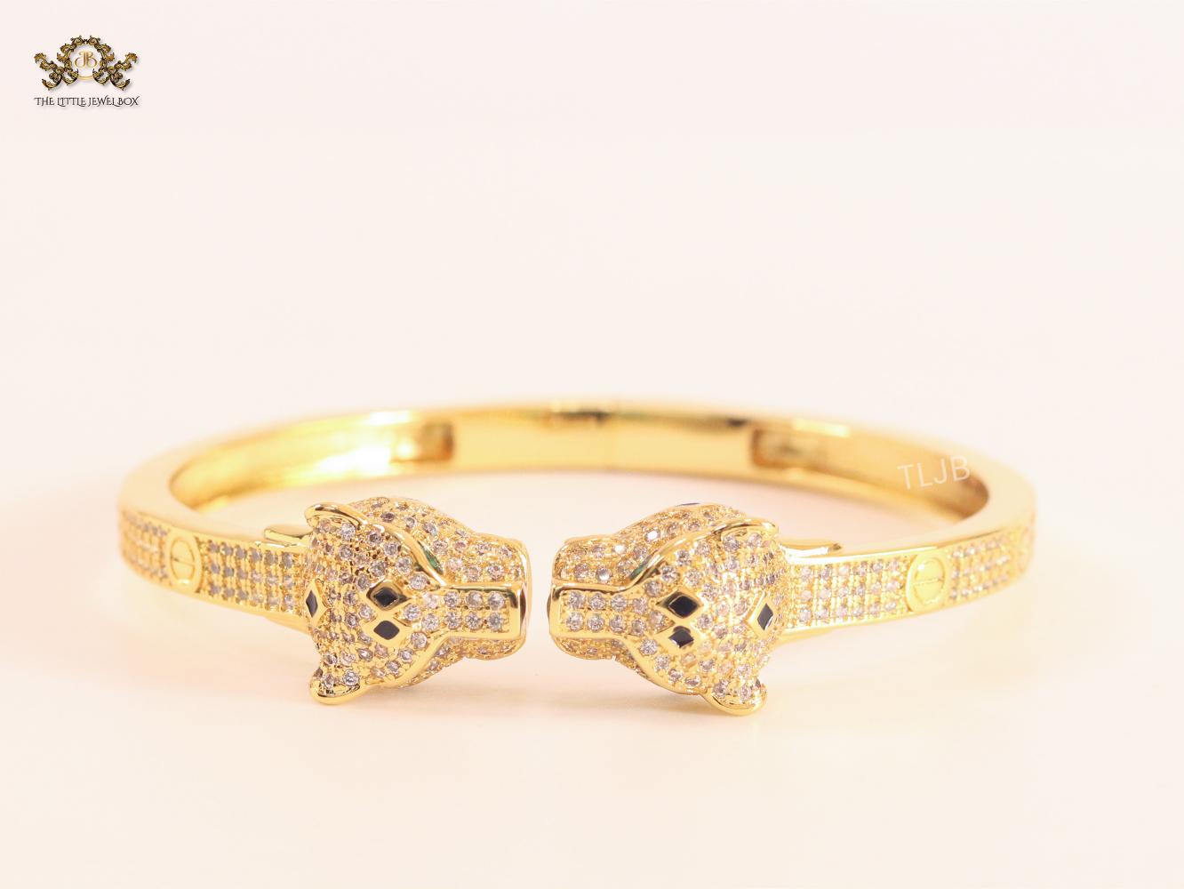 Panther heads gold and emerald bracelet