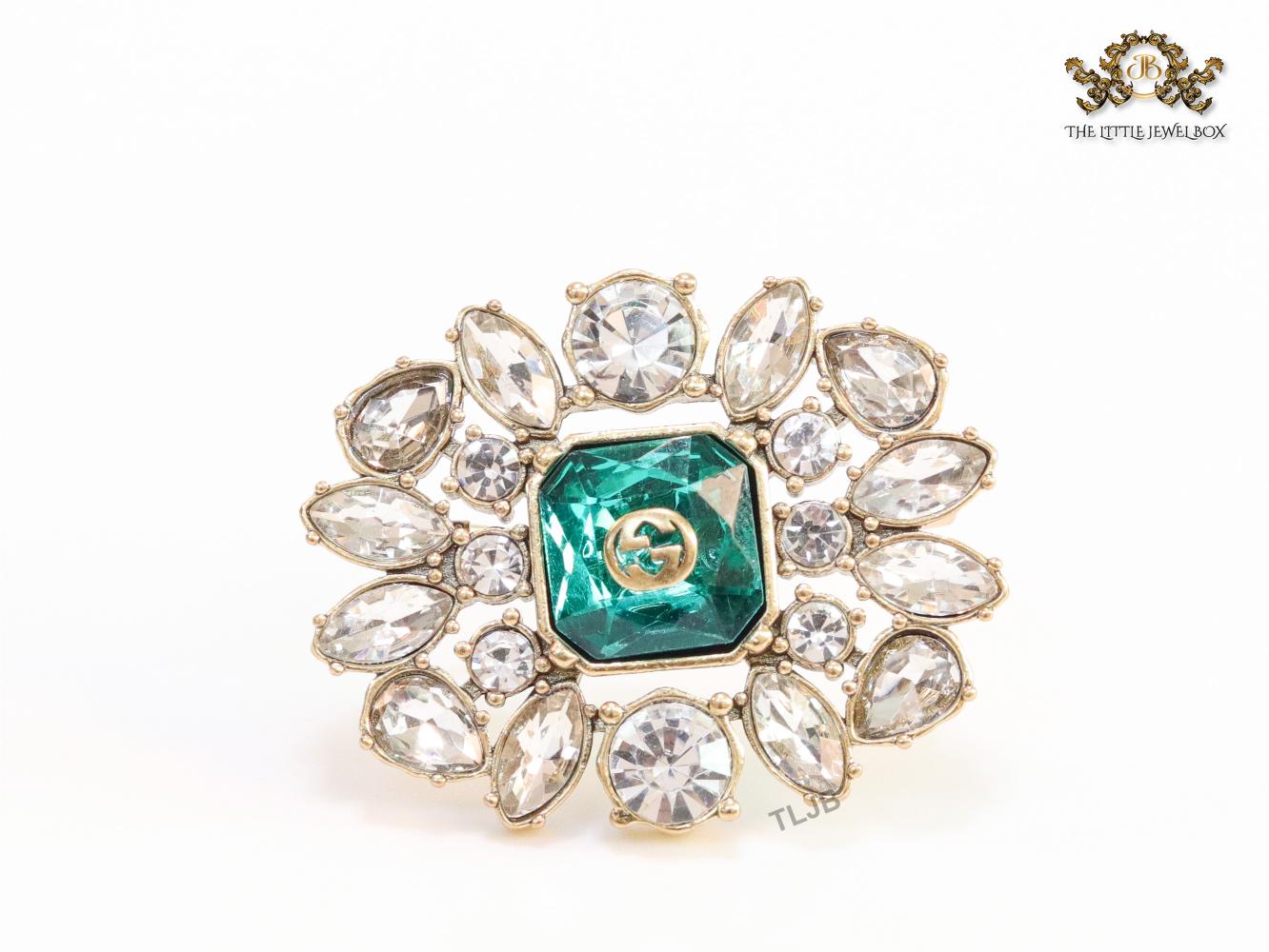 Emerald green stone and double G cz brooch