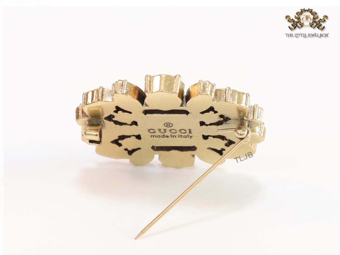 Emerald green stone and double G cz brooch