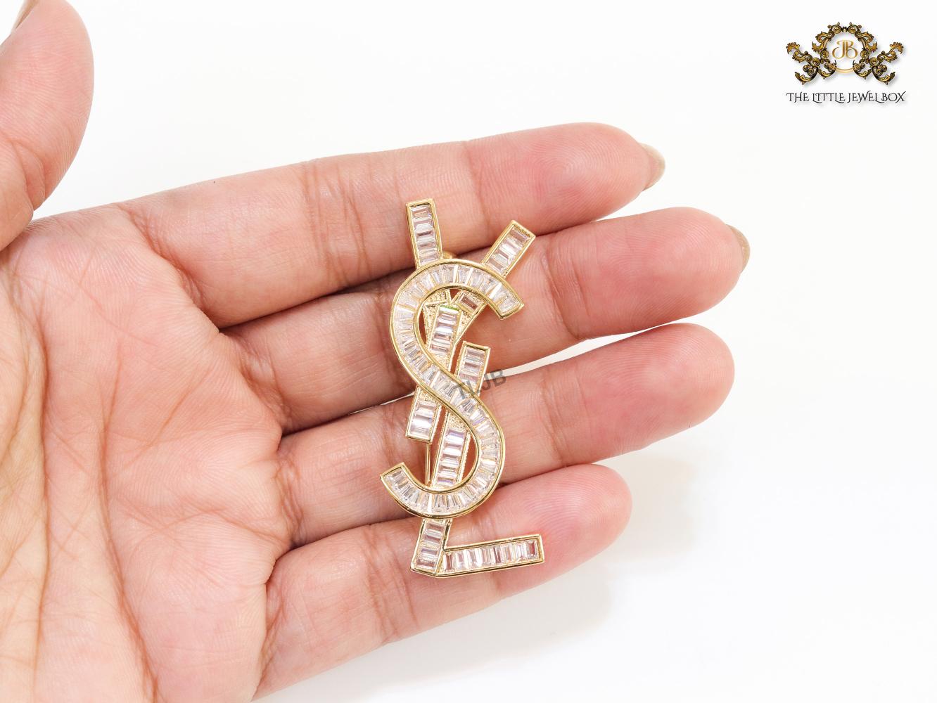 Golden alphabet brooch with cz baguettes