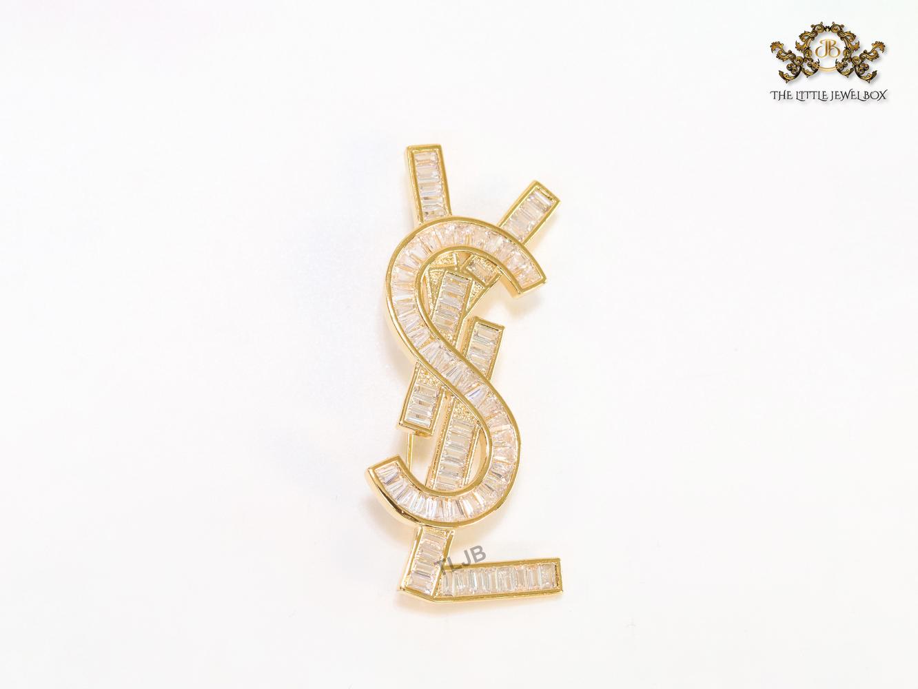 Golden alphabet brooch with cz baguettes