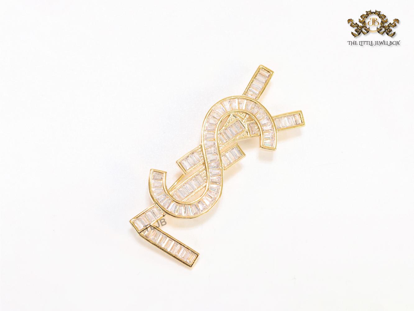 Golden alphabet brooch with cz baguettes