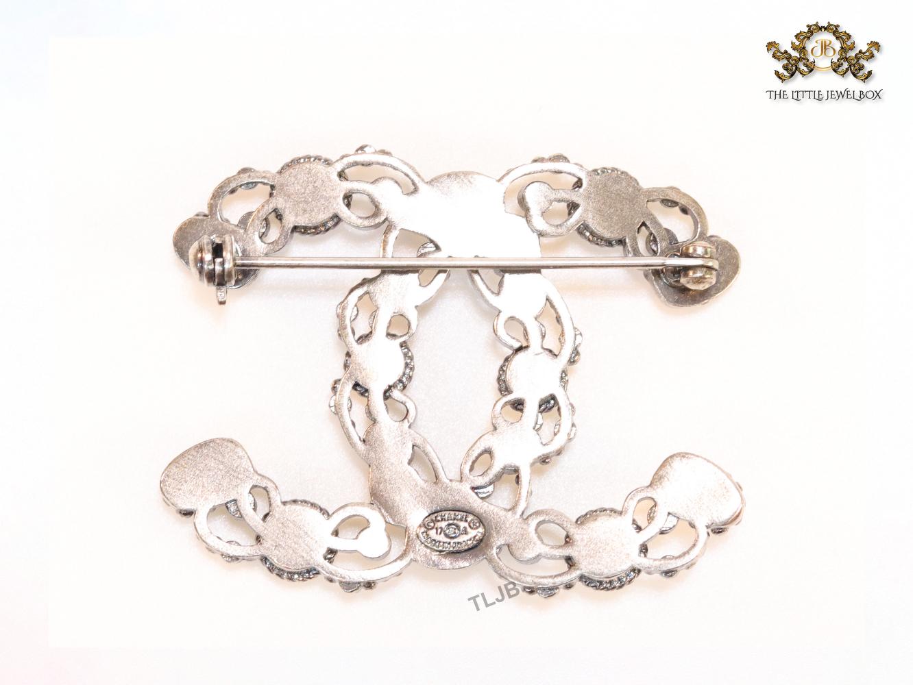 Antique platinum finish double C brooch with multi coloured stones