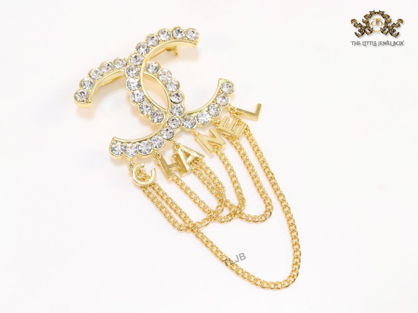 Double C gold and cz brooch with chains