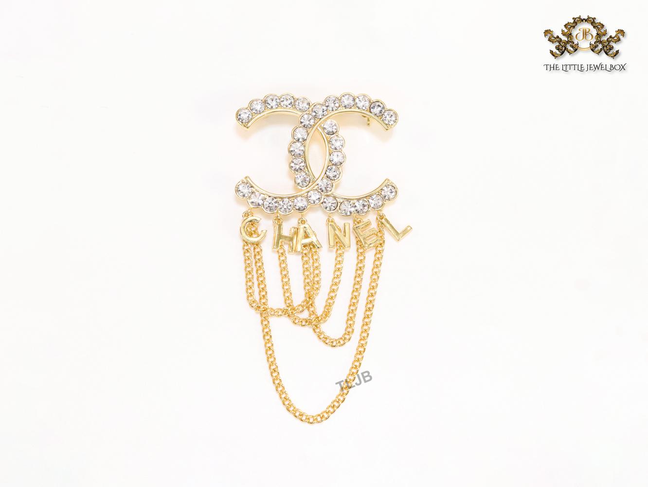 Double C gold and cz brooch with chains