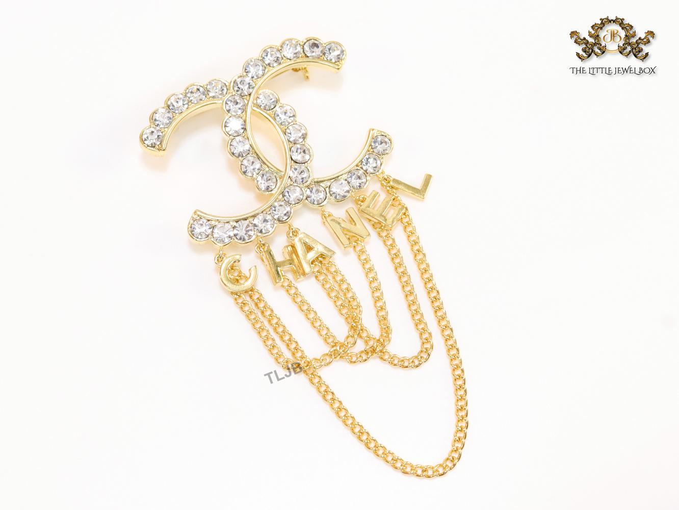 Double C gold and cz brooch with chains