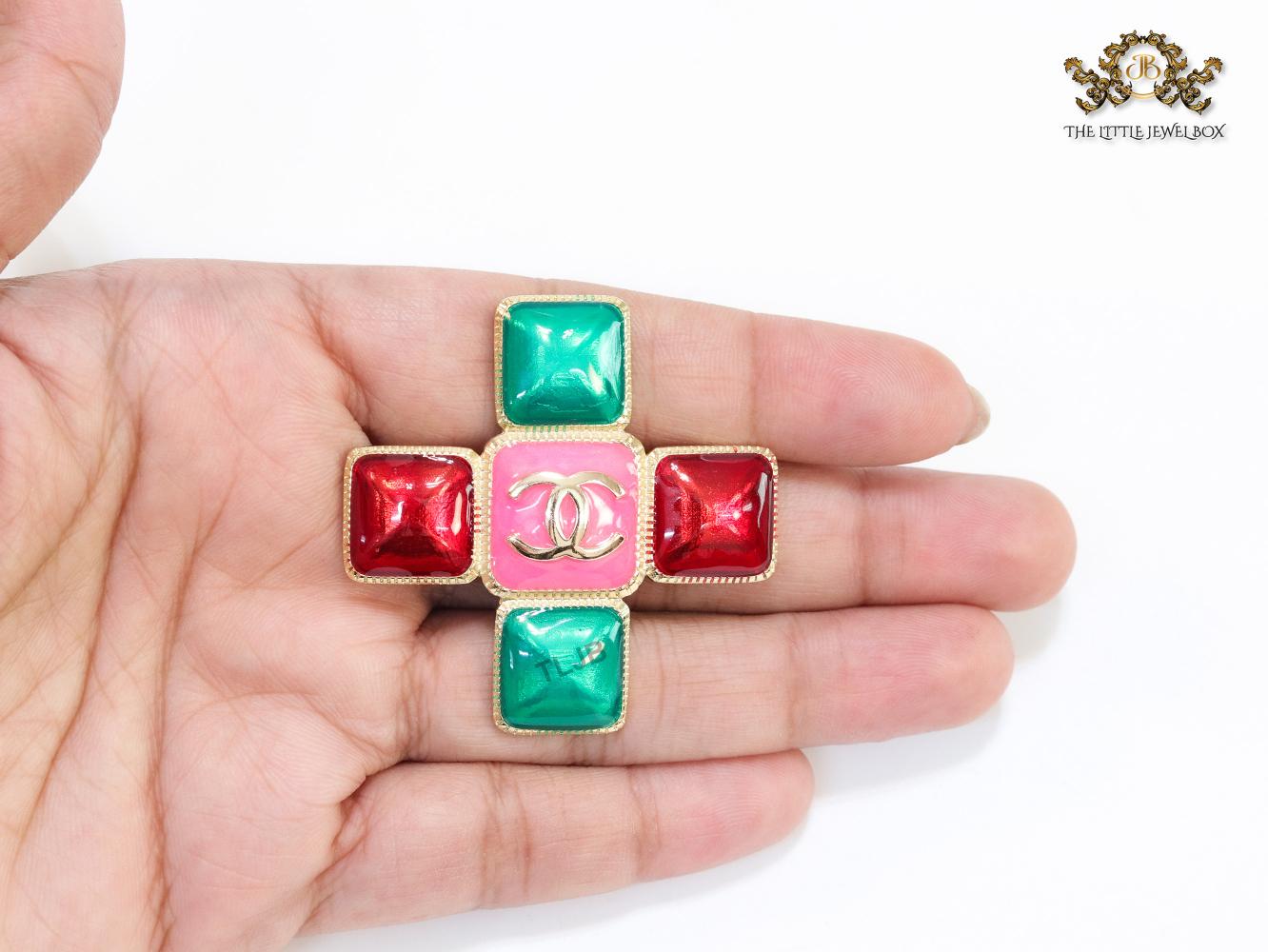 Multi Coloured enamel coated golden brooch with twin C motif