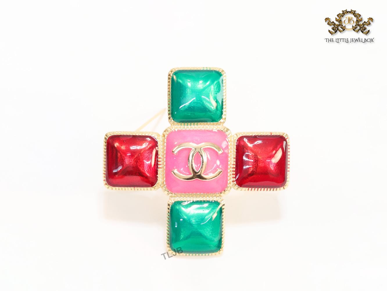 Multi Coloured enamel coated golden brooch with twin C motif