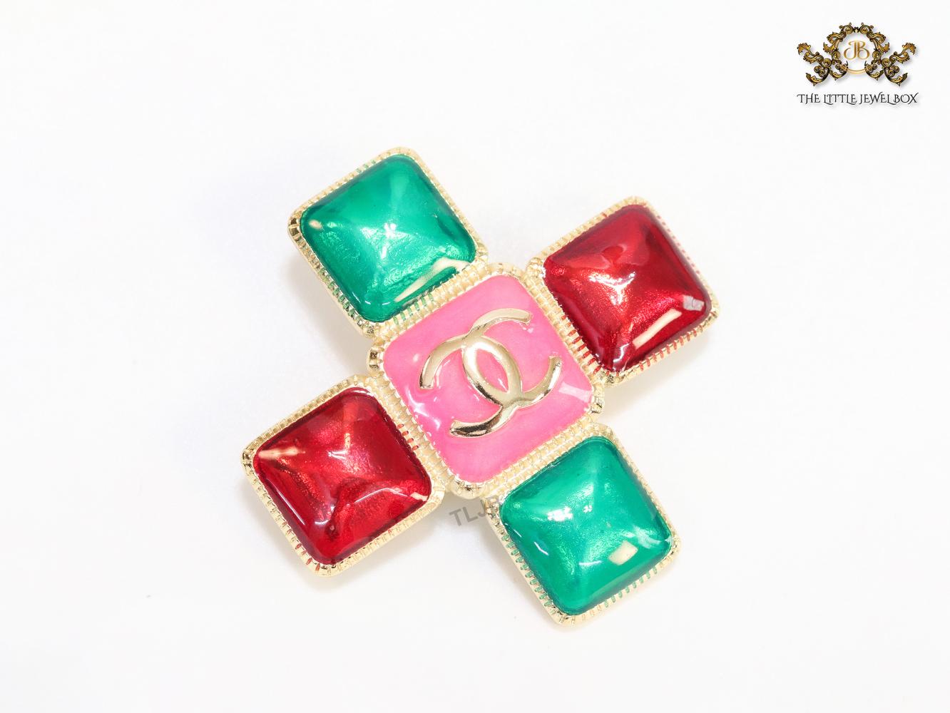 Multi Coloured enamel coated golden brooch with twin C motif