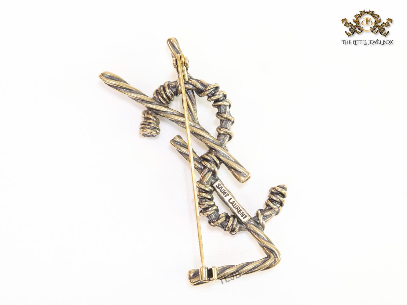 Antique gold finish alphabet brooch