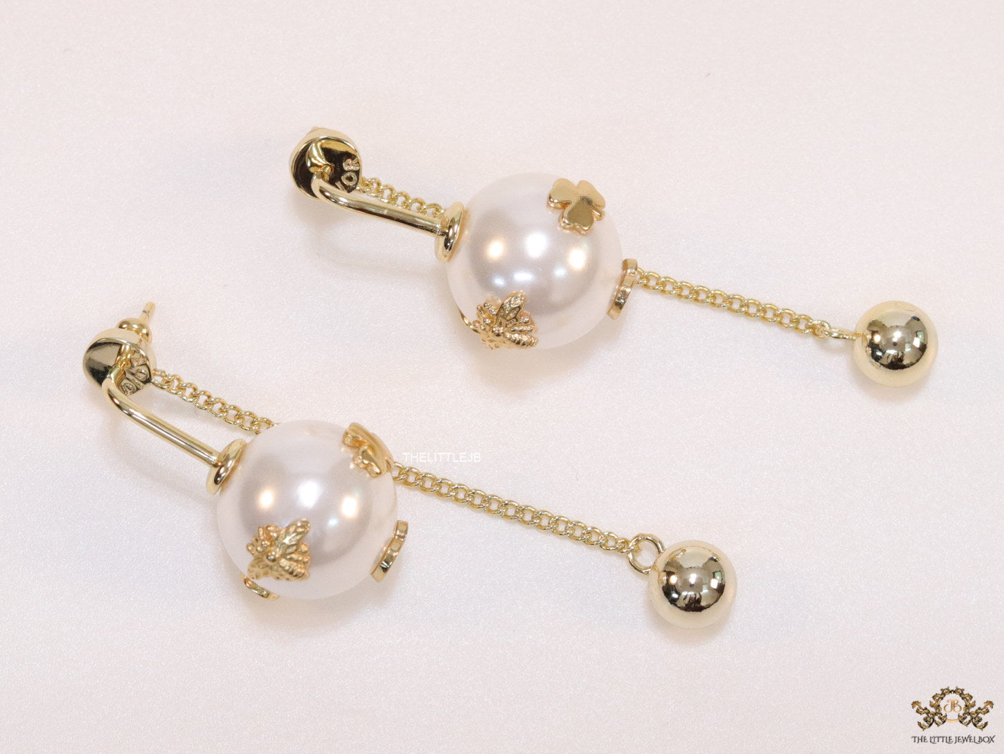 Detachable long chain pearl dangles in gold plating