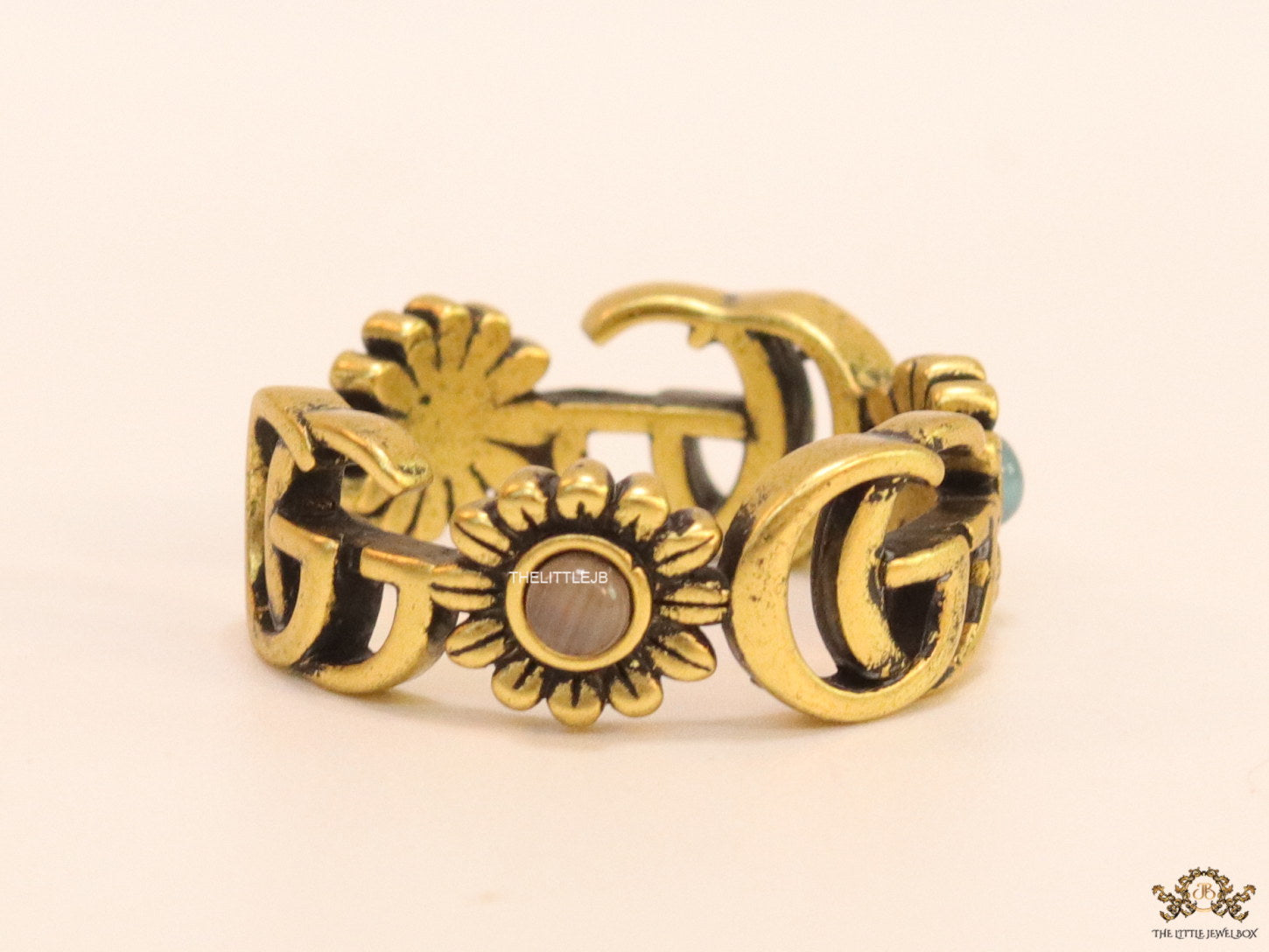 Gold plated twin G motif open ring