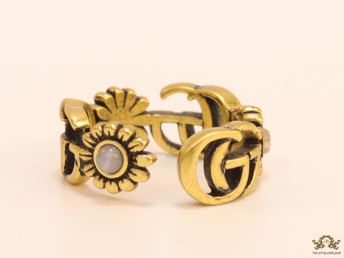 Gold plated twin G motif open ring