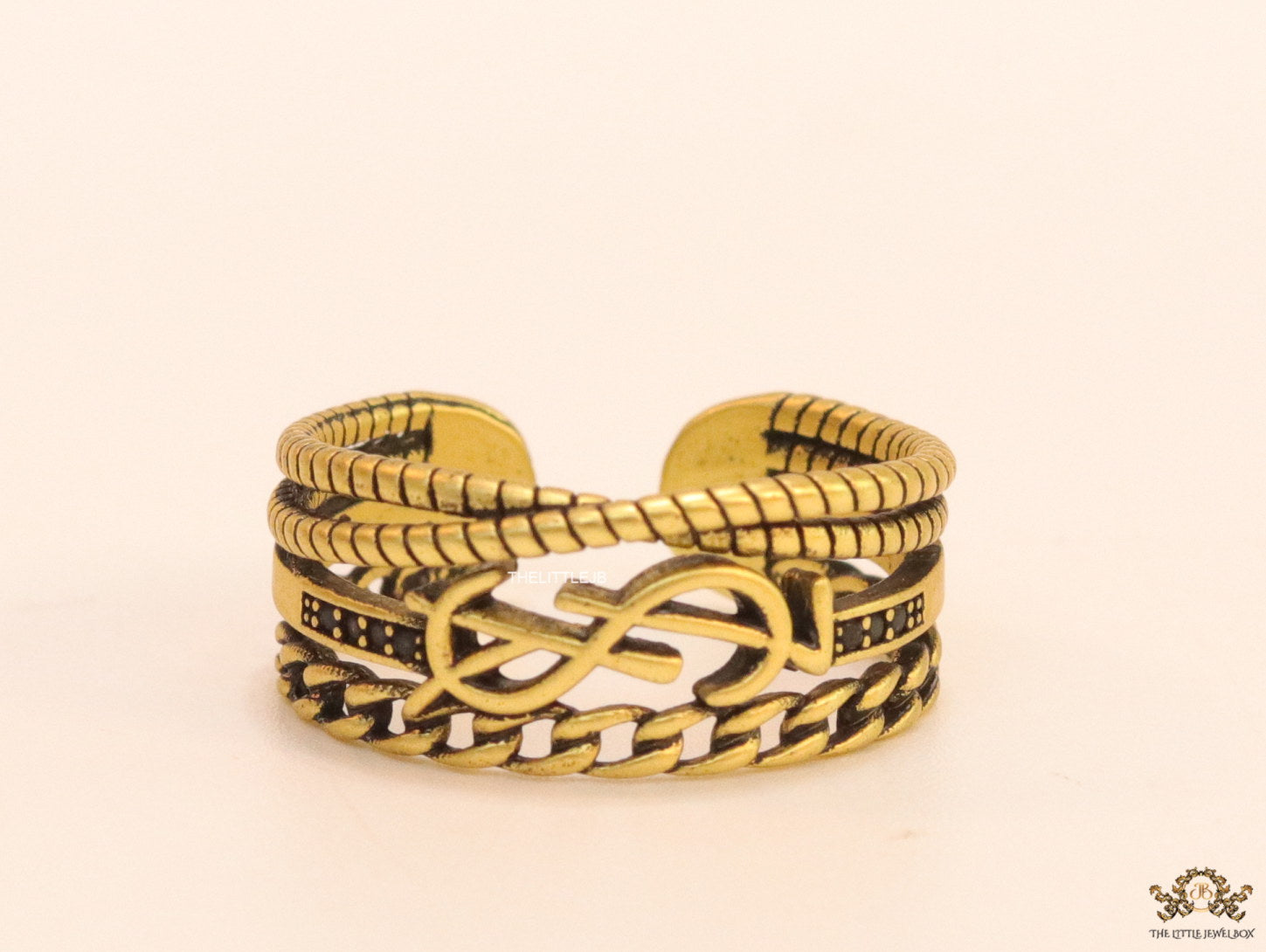Multilayered open golden ring with alphabet initial