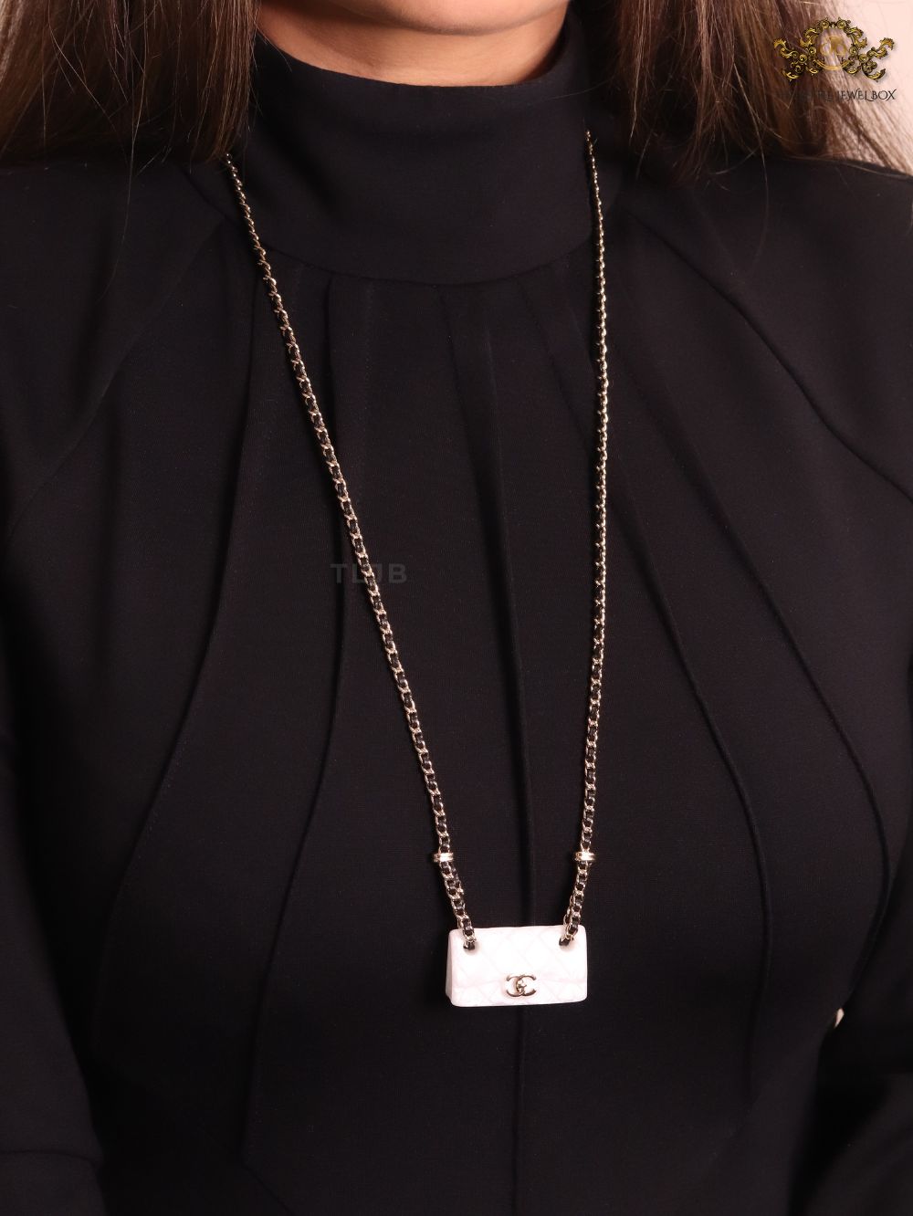 Double C enamel Bag on a black and gold chain