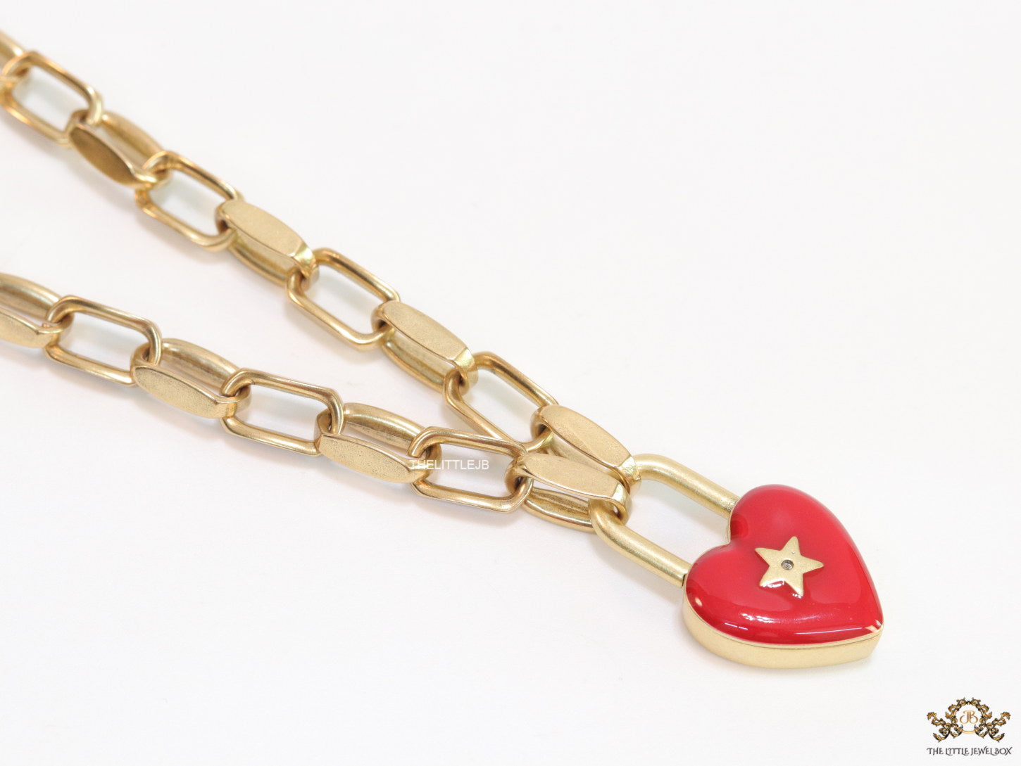 Golden link chain necklace with heart shape lock pendant