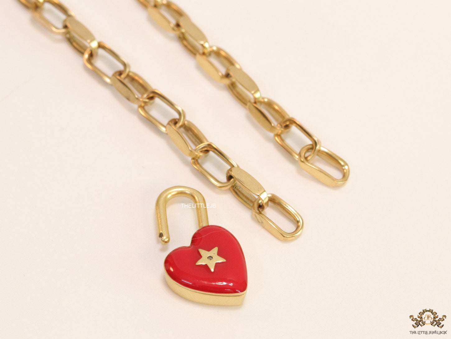 Golden link chain necklace with heart shape lock pendant