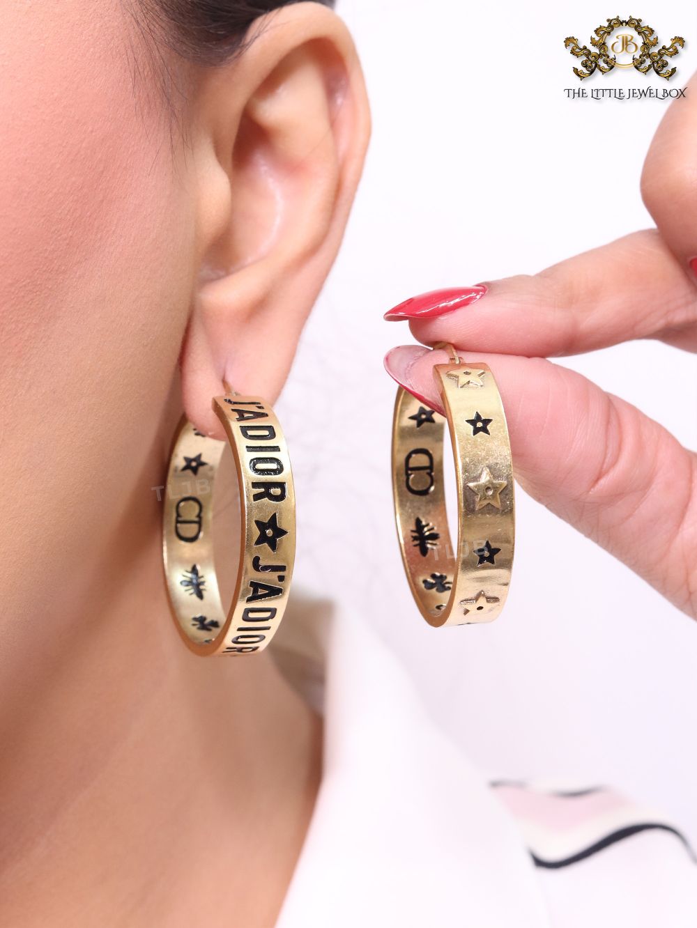 Alphabet C and D embossed on gold hoops