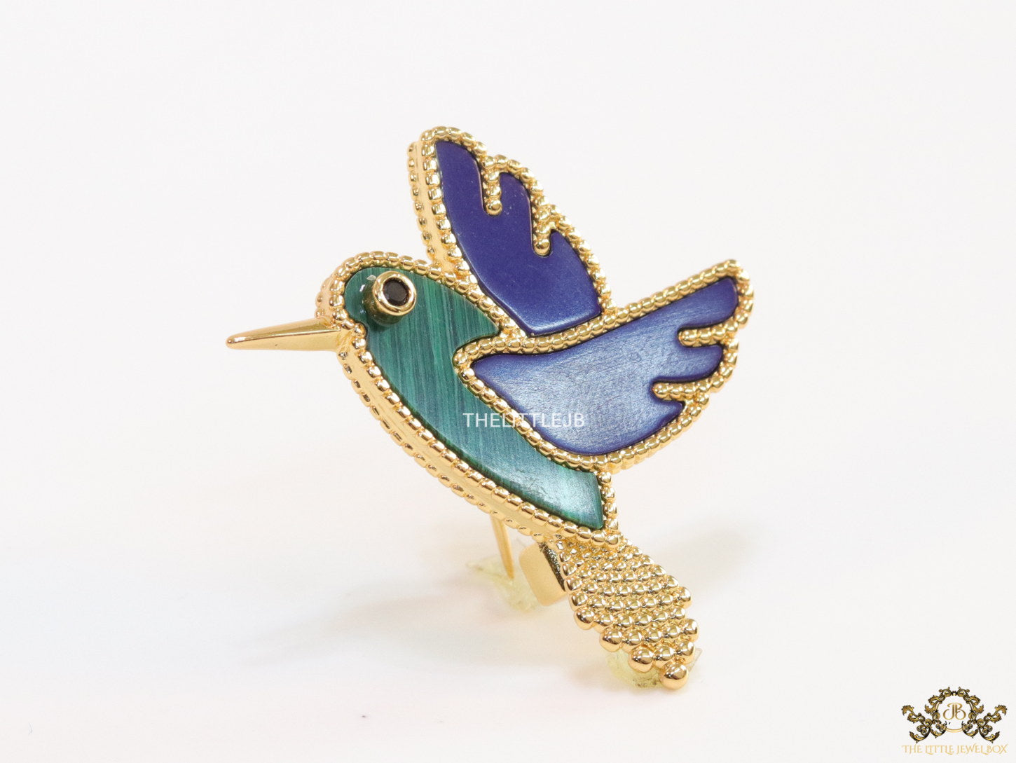 Gold plated multi-colour flying bird brooch
