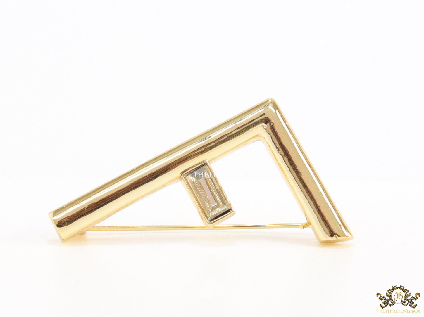 Gold plated alphabet F brooch with baguette cubic zirconia stone