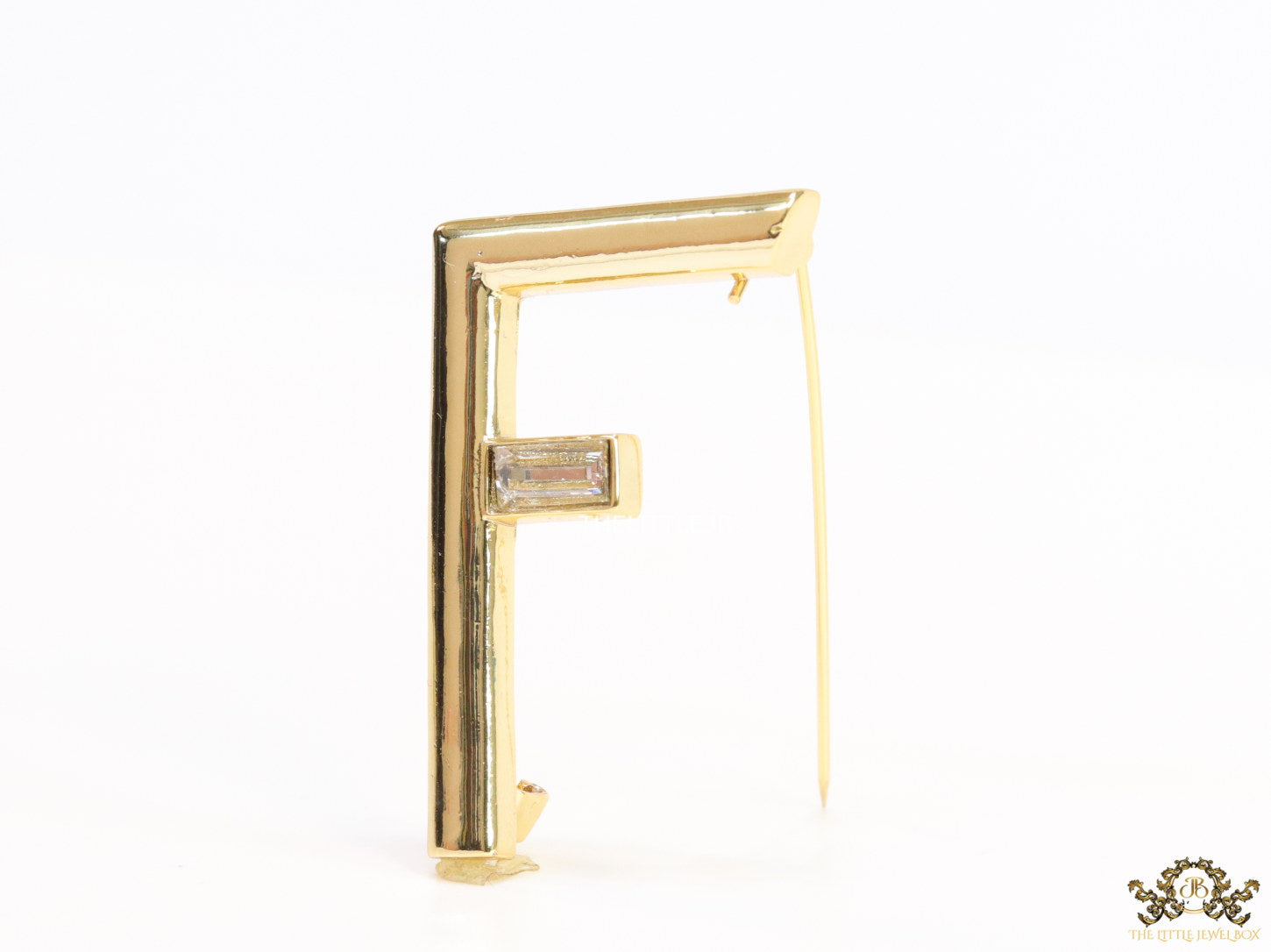 Gold plated alphabet F brooch with baguette cubic zirconia stone
