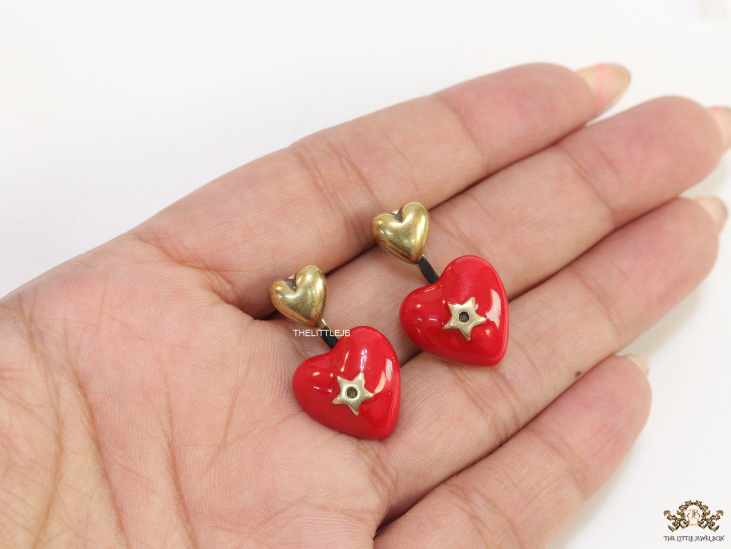 Golden and red detachable studs with twin hearts