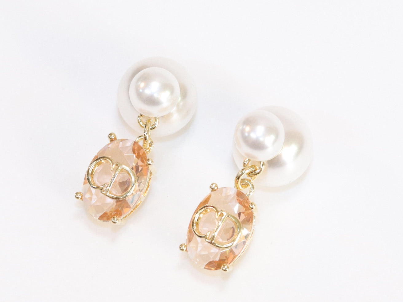 Alphabet C and D dangling baby pink stone pearl studs in rose gold finish