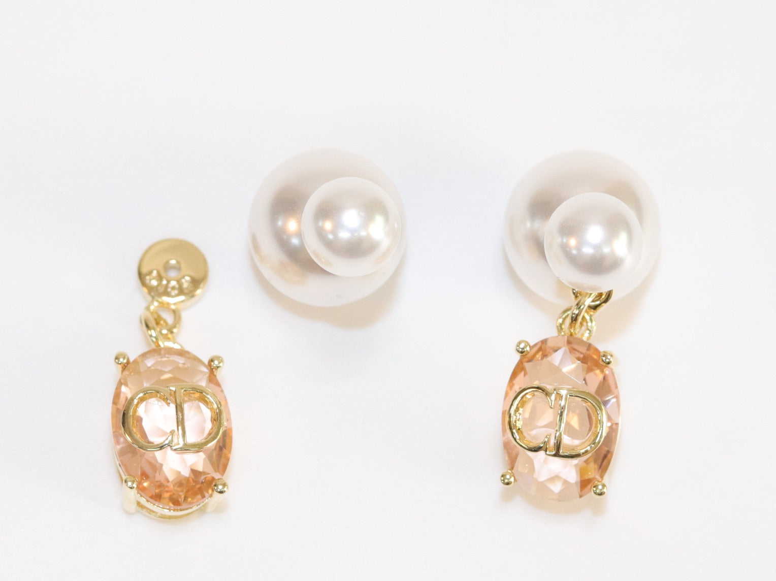 Alphabet C and D dangling baby pink stone pearl studs in rose gold finish