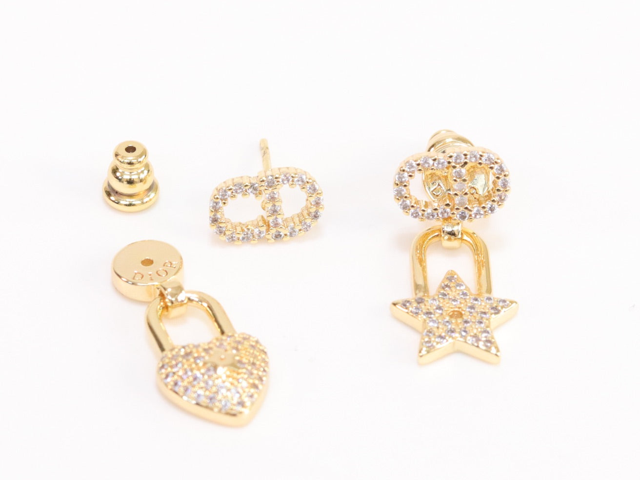 Alphabet C and D lock and star dangling stud in gold finish with cz