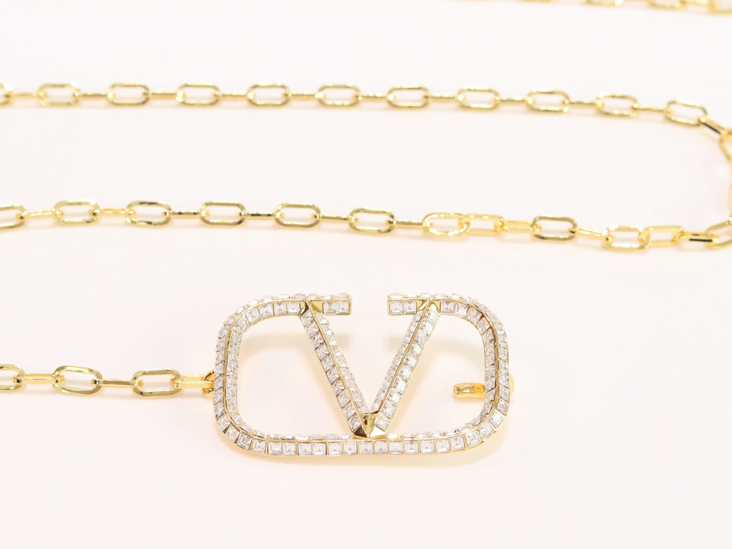 Open V and gold chain waist belt