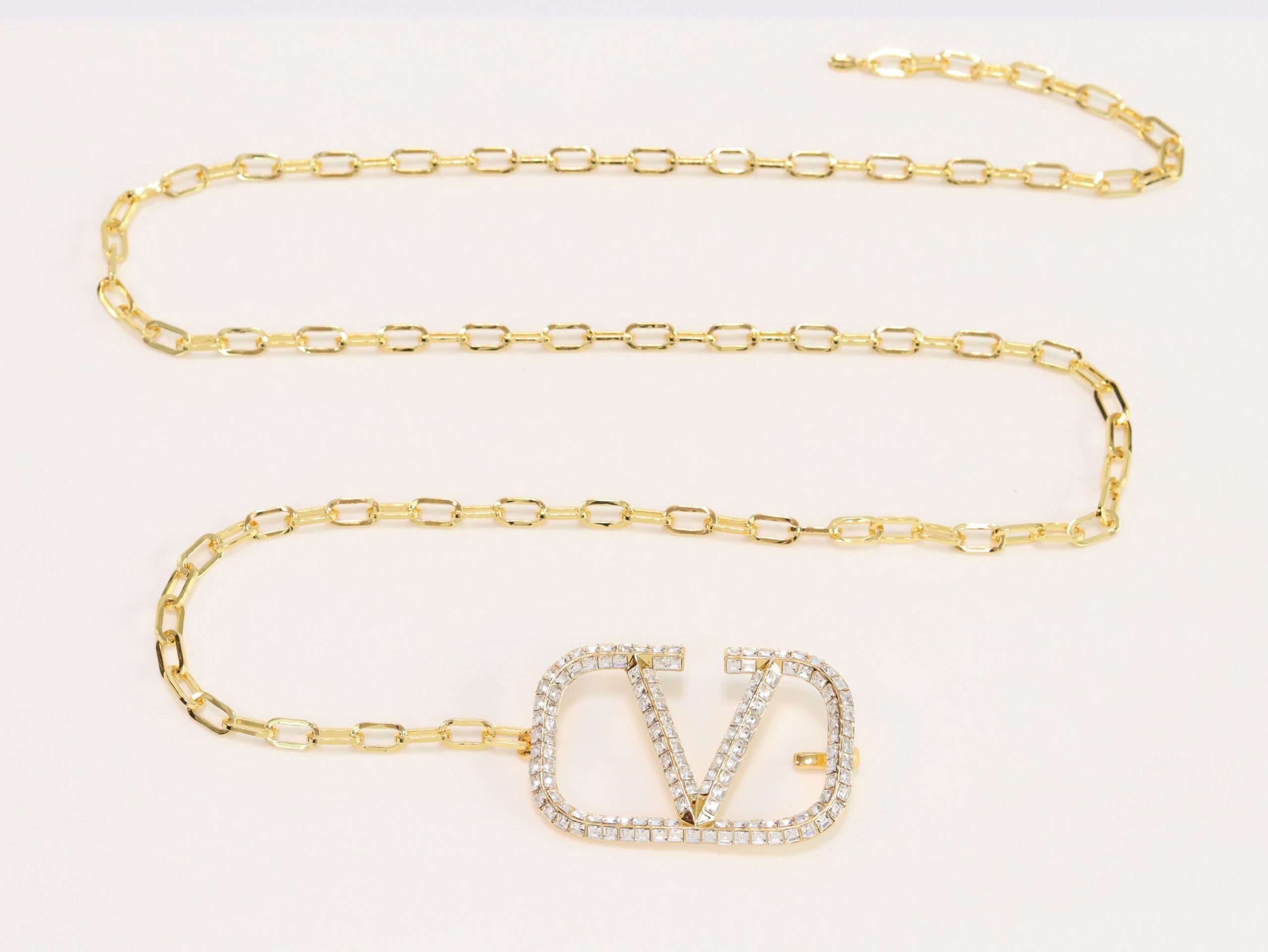 Open V and gold chain waist belt