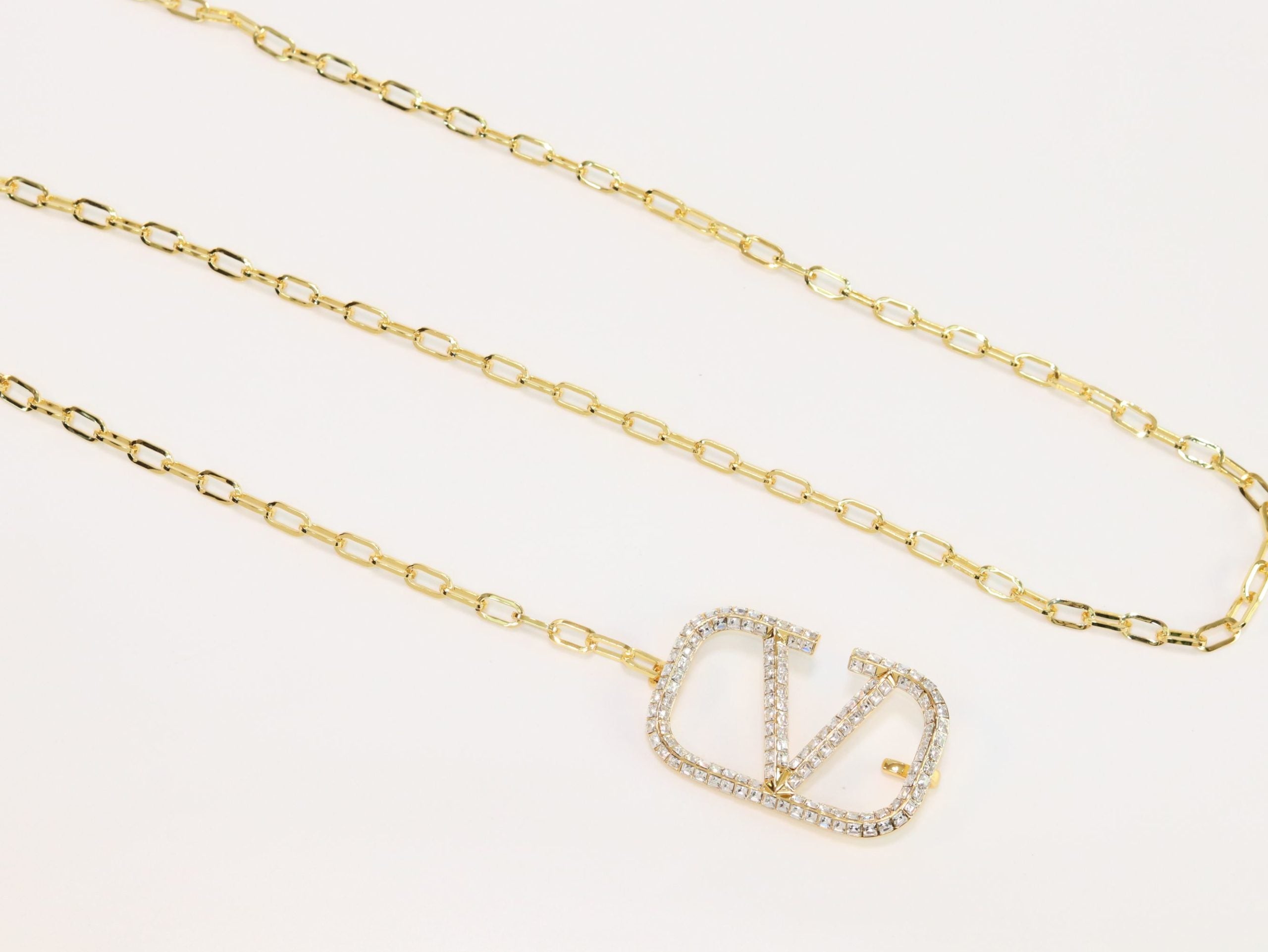 Open V and gold chain waist belt