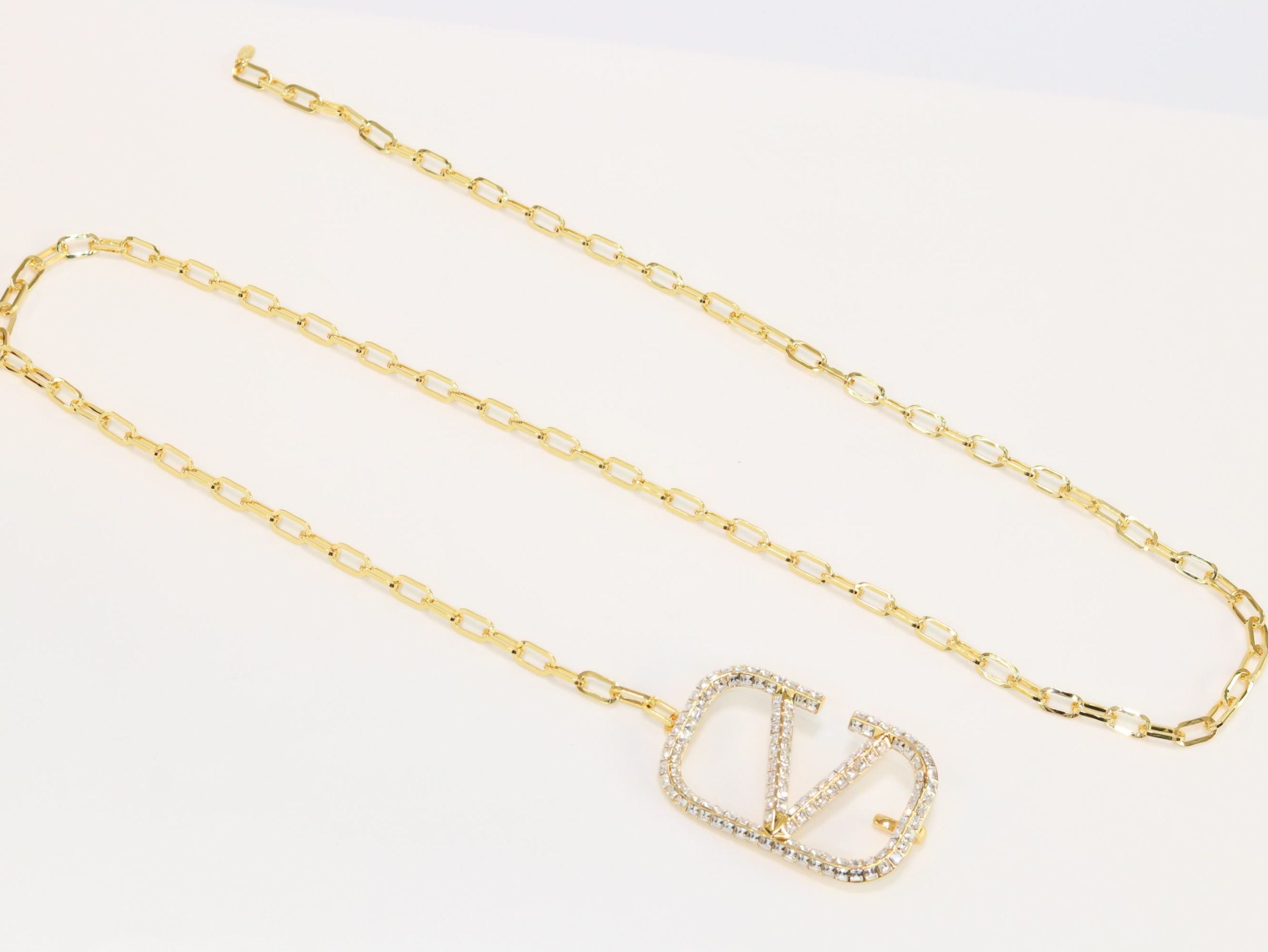 Open V and gold chain waist belt