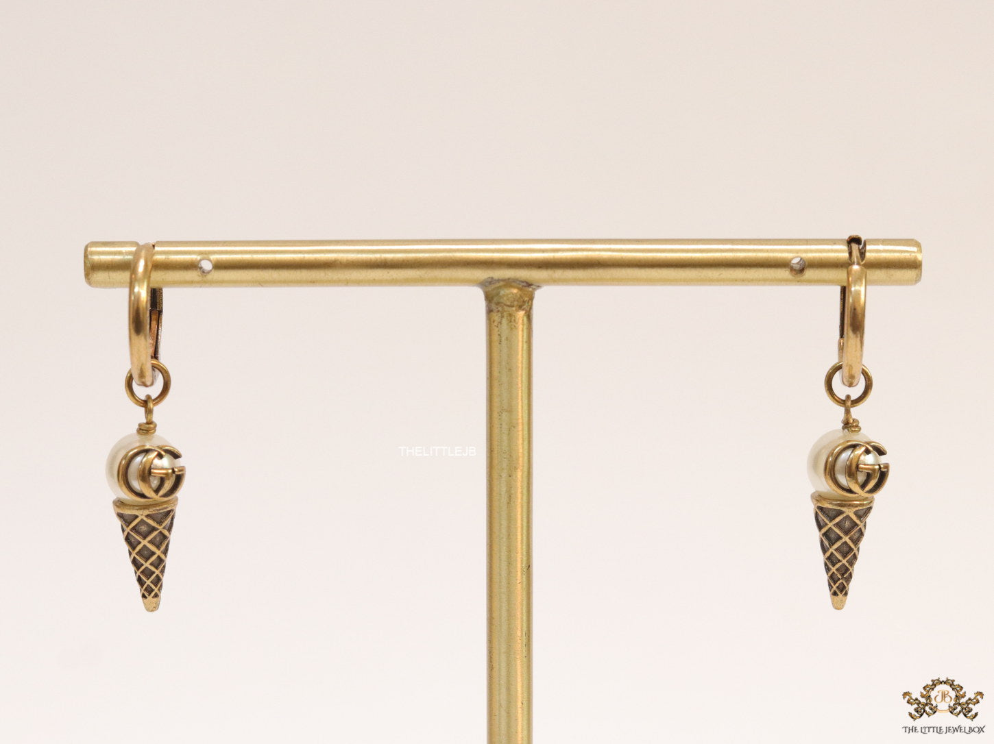 Small gold plated hoops with twin G and softy drops