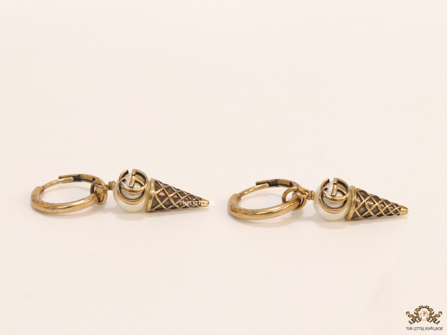 Small gold plated hoops with twin G and softy drops