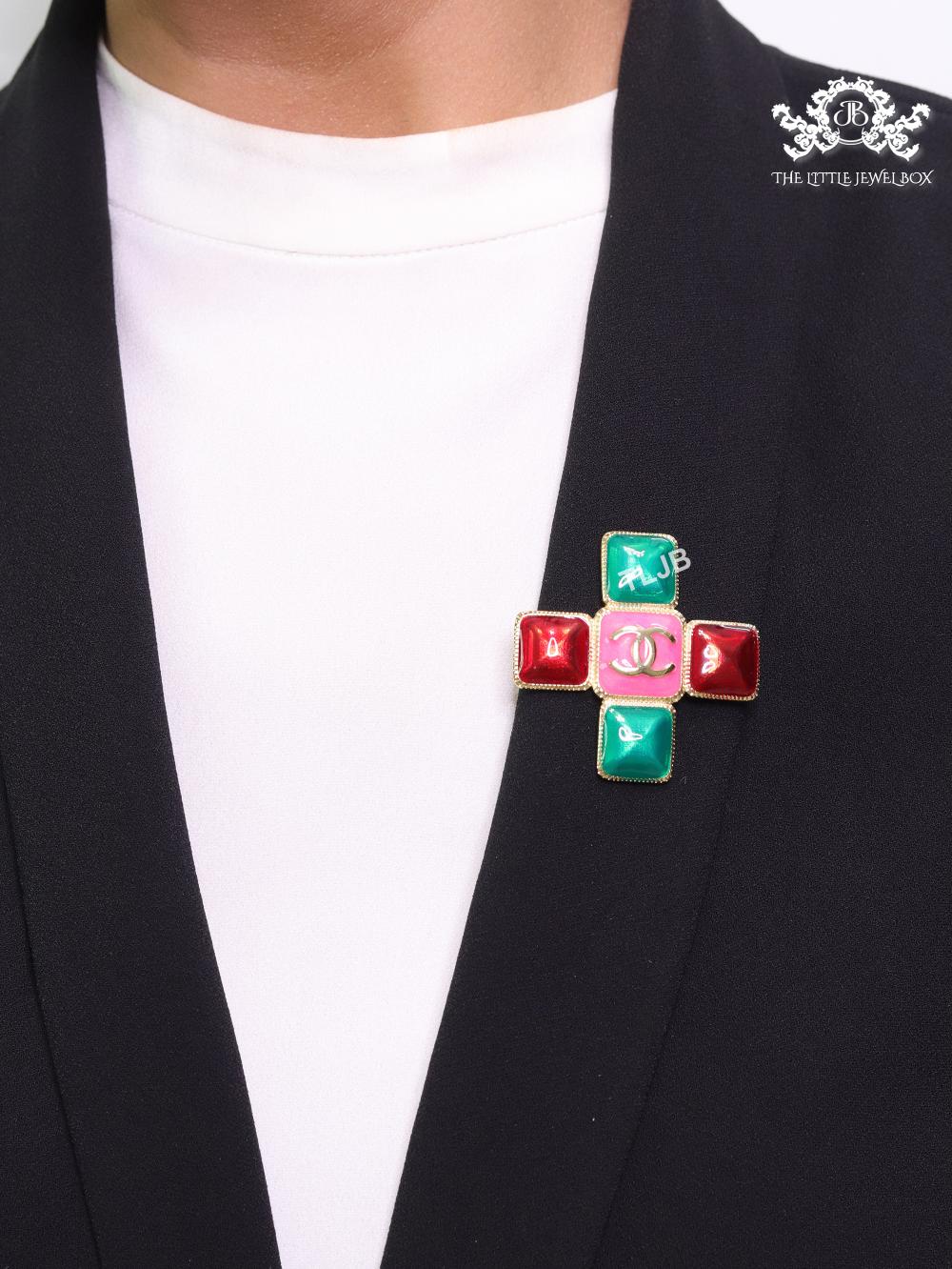 Multi Coloured enamel coated golden brooch with twin C motif