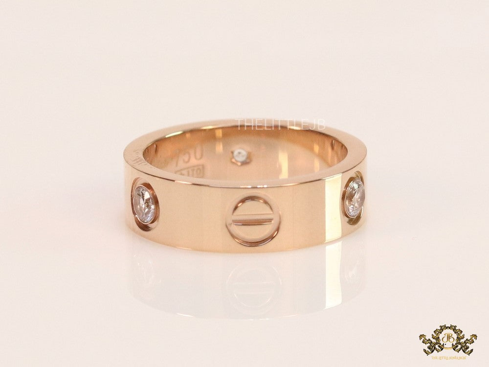 Broad 6mm rose gold band with screws and stones