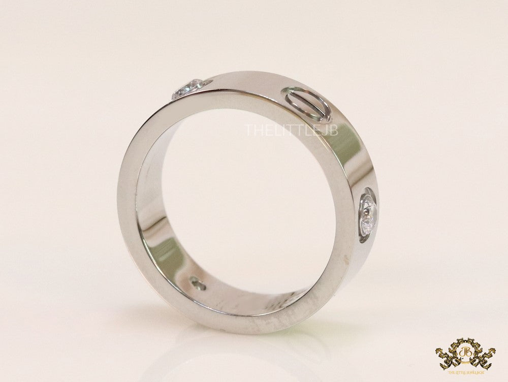 Broad 6mm platinum plated band with screws and stones
