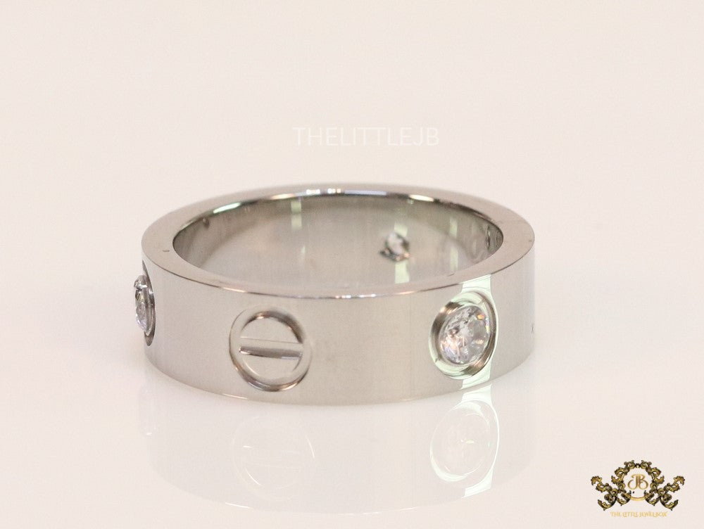 Broad 6mm platinum plated band with screws and stones