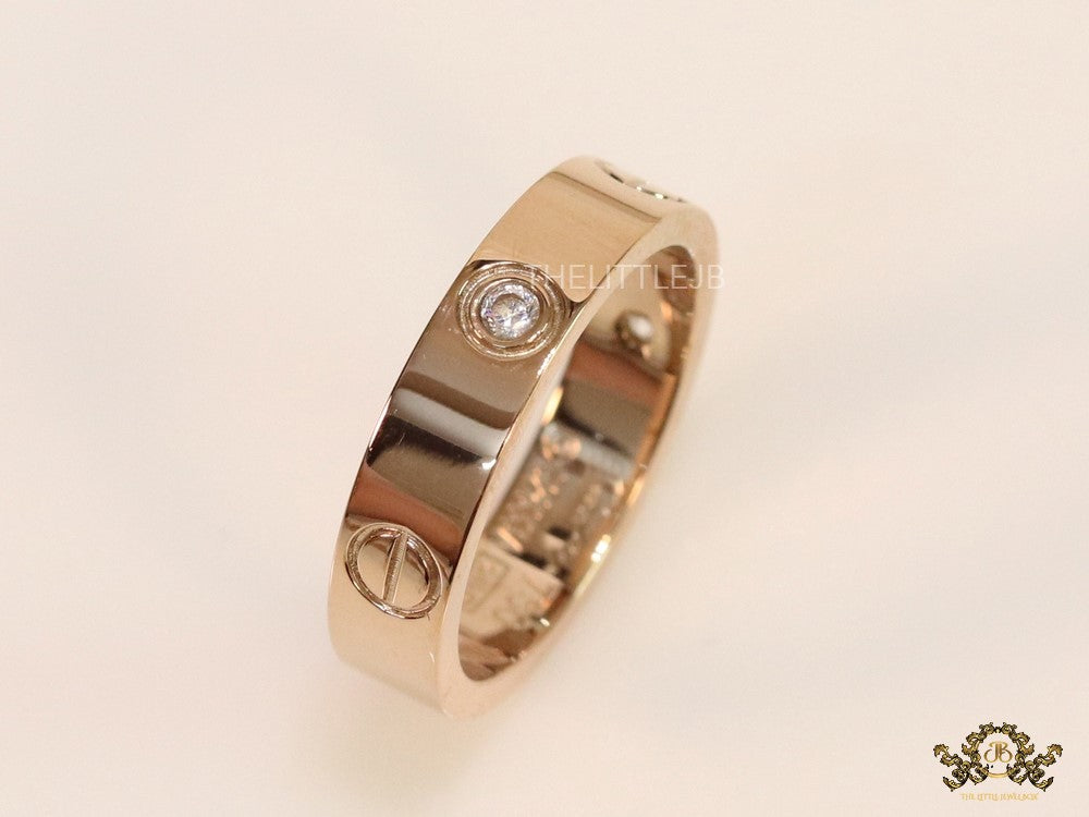 Narrow 4.5mm rose gold band with screws and stones