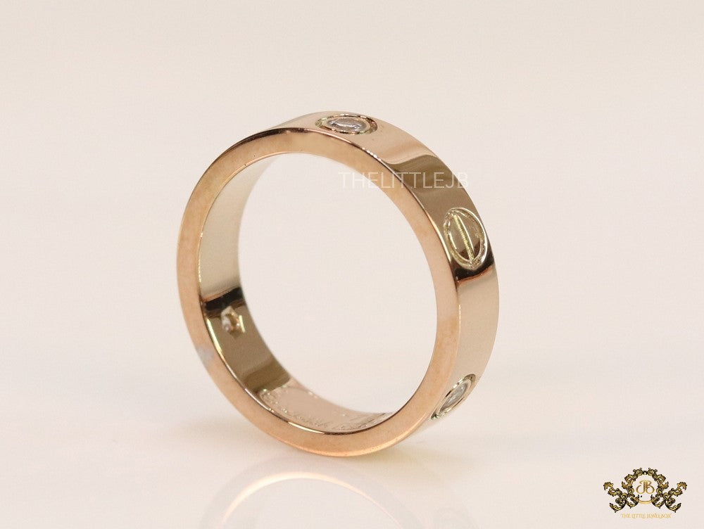 Narrow 4.5mm rose gold band with screws and stones