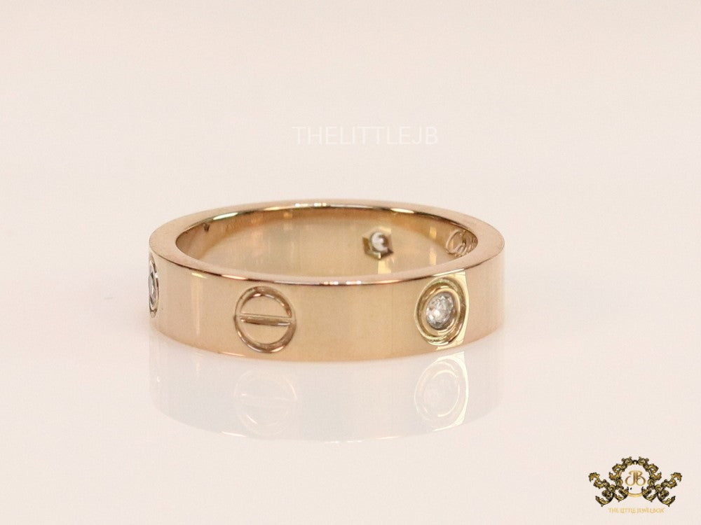 Narrow 4.5mm rose gold band with screws and stones
