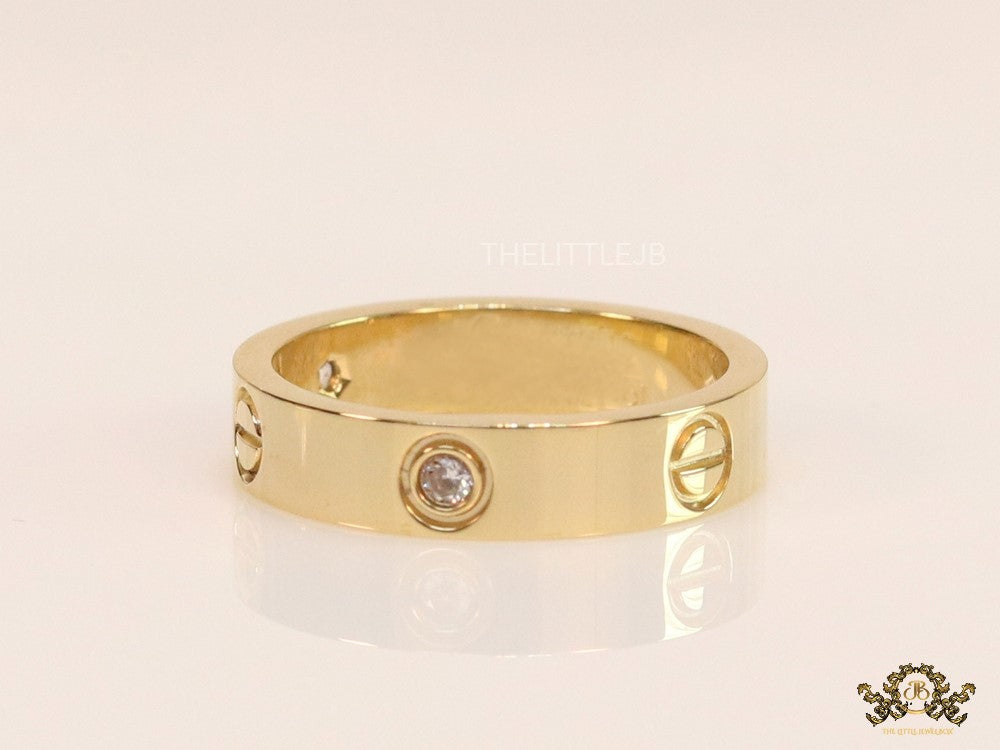 Narrow 4.5mm gold band with screws and stones